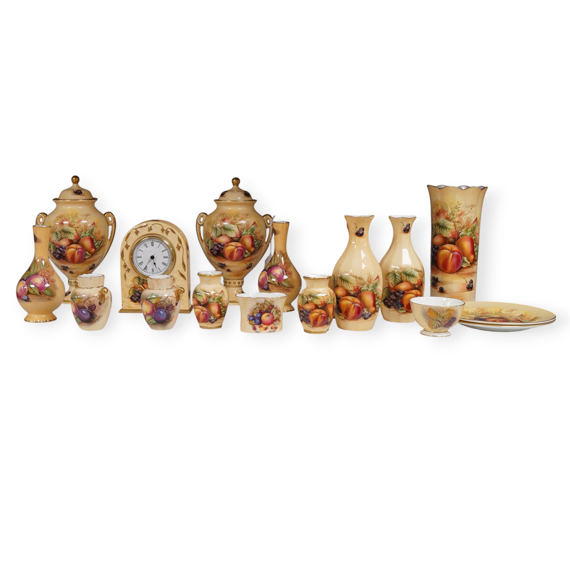 A collection of Aynsley Orchard Gold wares including a timepiece, vases, etc. tallest 23cm